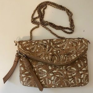 Beachy crossbody purse with brass strap and cut-out detailing